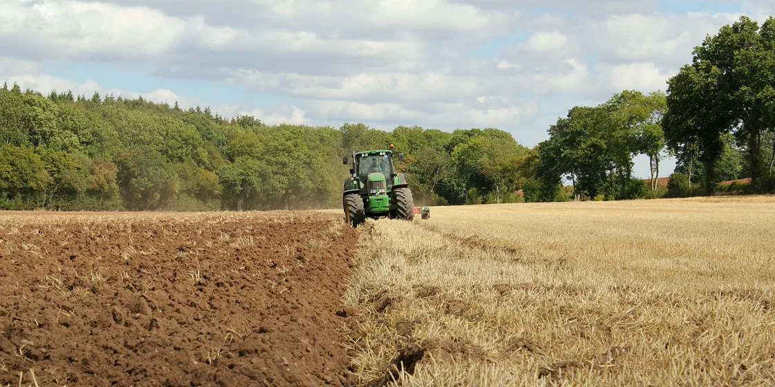 Agricultural tractor working in a field