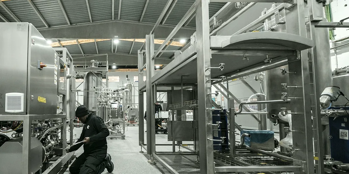 Industrial maintenance technician servicing machinery